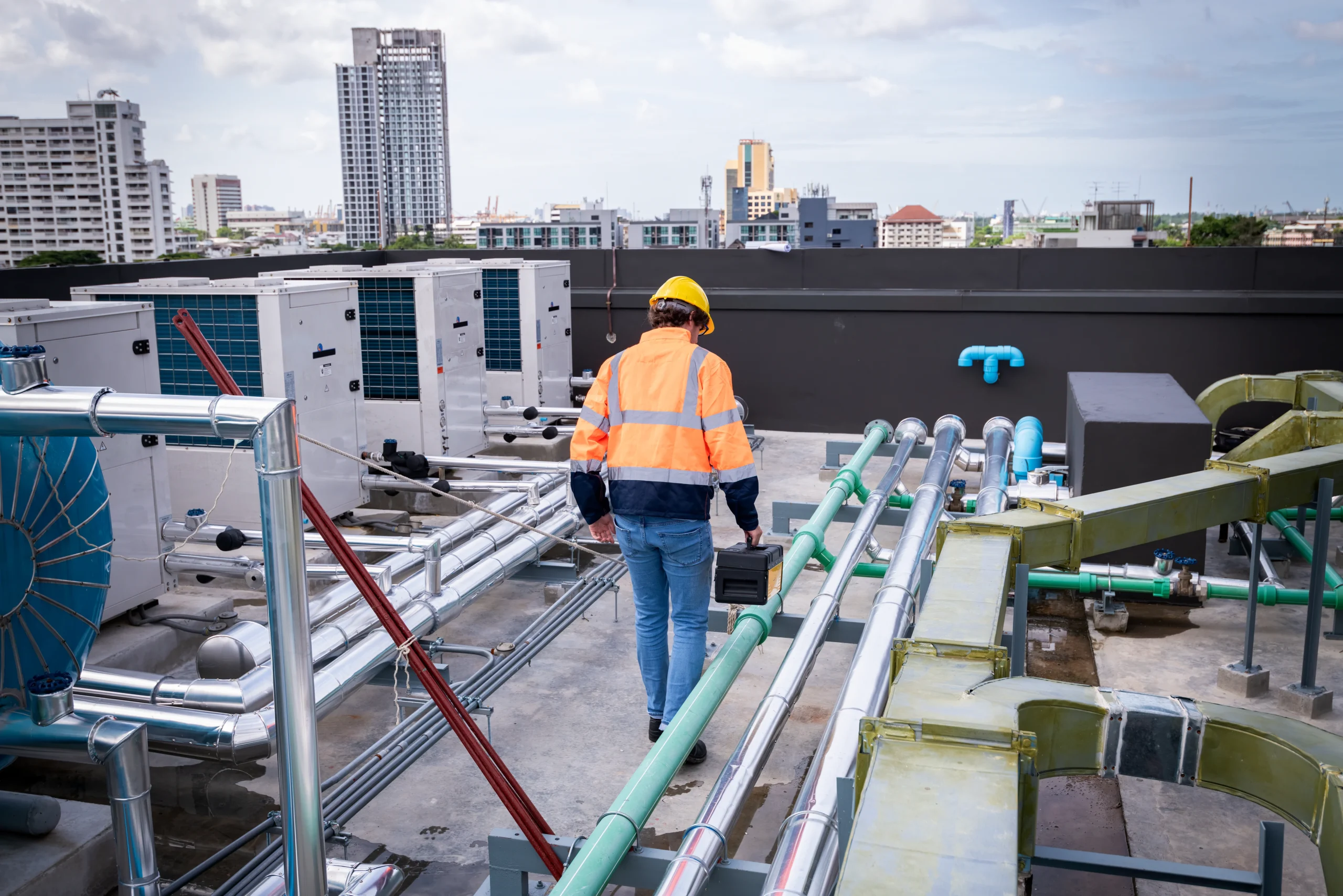 Project engineer inspecting building systems during commercial renovation planning
