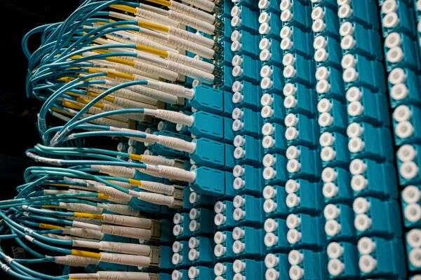 Clean fibre and structured cabling installed in a commercial telecommunications room